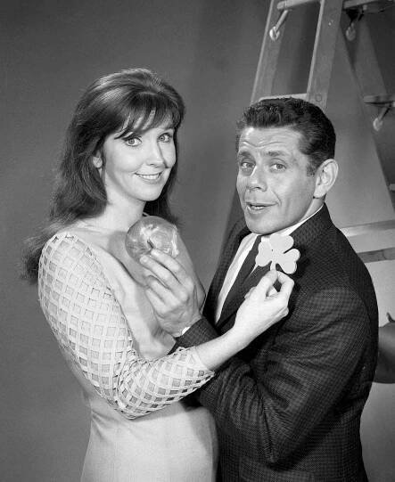 The husband and wife comedy team of Anne Meara and Jerry Stiller appears on the CBS variety program 'The Ed Sullivan Show,' New York, November 7, 1966. Meara holds a shamrock up to Stiller as he holds a bagel to her.