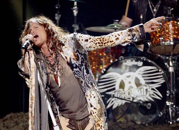 Steven Tyler singing on stage.
