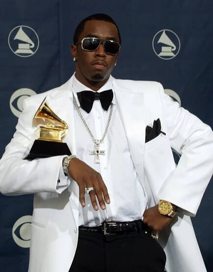 Sean "Diddy" Combs holding a Grammy award.
