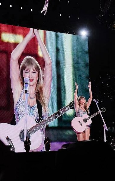 Swift singing onstage dressed in a sparkling bodysuit