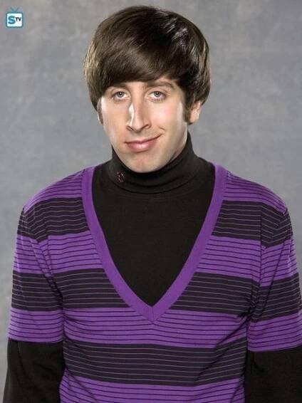 a young man wearing a purple and black sweater