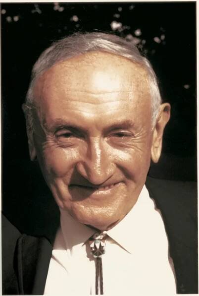 Zwicky wearing his characteristic bolo tie