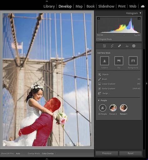 Photo of a wedding couple on a bridge with the groom selected with the new Select People tool in Adobe Lightroom