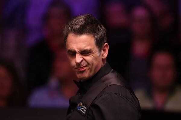 Ronnie O'Sullivan reacting during a snooker match.