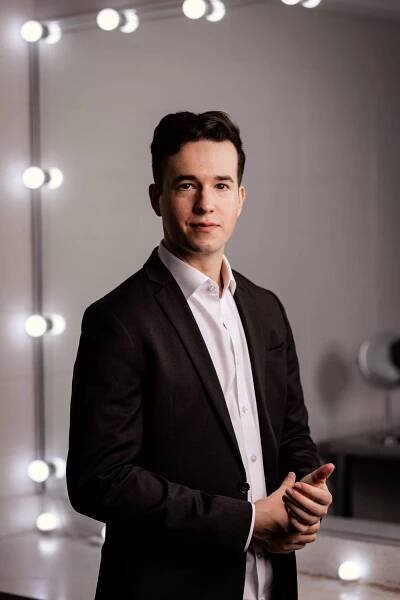 man in front of light up mirror 