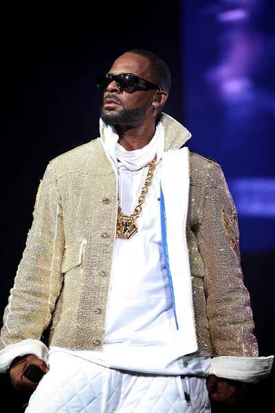 Image may contain R. Kelly Sunglasses Accessories Accessory Human Person and Pendant
