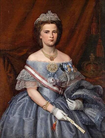 Marie Sofie Bavorská, mladší sestra slavné Alžběty Bavorské (Sisi). Do roku 1861 byla Marie poslední královnou obojí Sicílie (obraz je z roku 1870). Byla nekonvenční a nespoutaná.