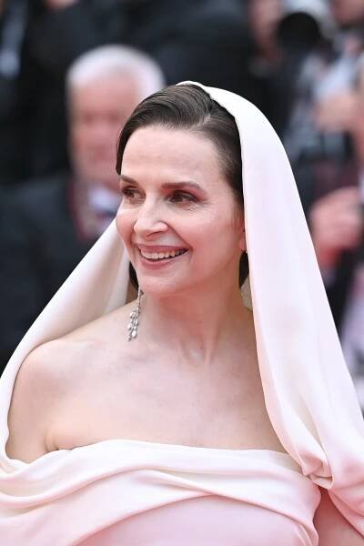 Image may contain Juliette Binoche Face Happy Head Person Smile Clothing Dress Adult Wedding and Photography