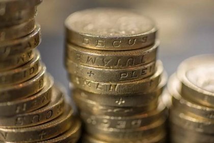 A closeup of British pound coins