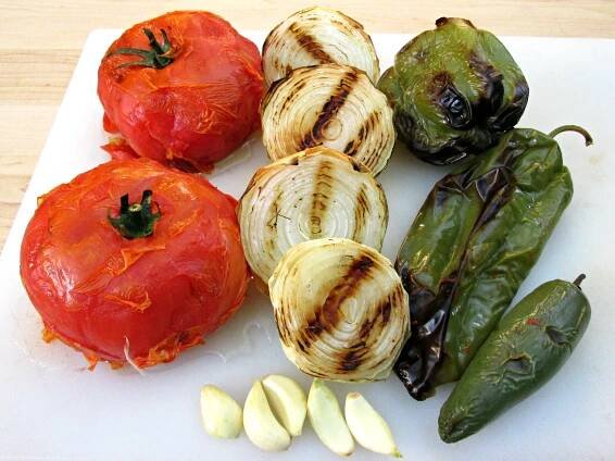 Charred jalapeño pepper fresh off the grill for salsa.
