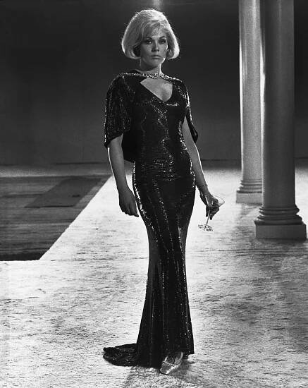 Kim Novak wears a beaded gown in 1967