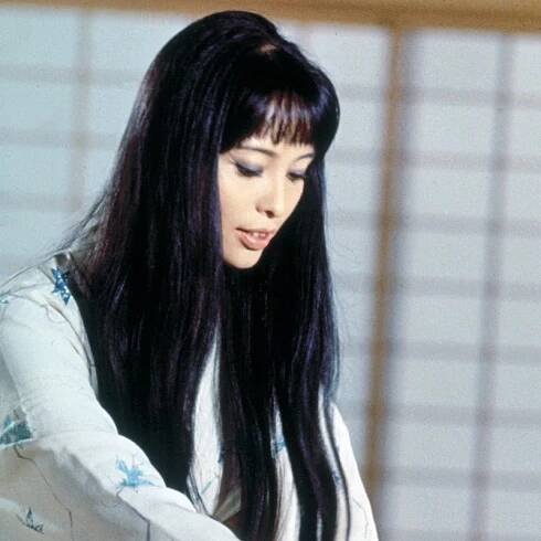 Akiko Wakabayashi wears long, dark, straight hair with bangs in 1967