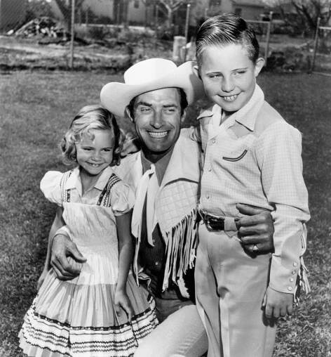 Sally Field and her brother Richard, with their stepfather, stuntman and actor Jock Mahoney, costumed for a role on one of his television westerns in the 1950s. (PhotoFest) 