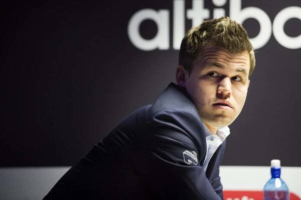 Chess Grandmaster Magnus Carlsen in Thoughtful Pose Wallpaper