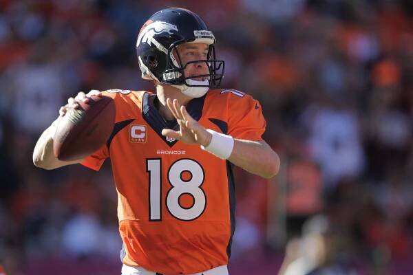 Broncos quarterback Peyton Manning throws against the Redskins.