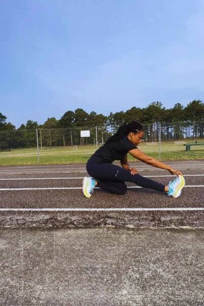 kneeling fold hamstring stretch is great for runners after a run