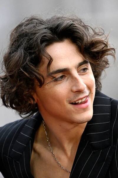 Timothée Chalamet Skipped the Shirt for His First Wonka Appearance — See Photos
