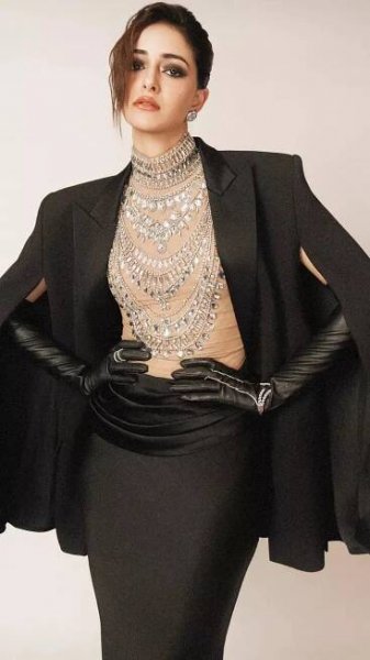 Ananya Panday stuns in a dramatic black gown with a cape blazer and a bedazzled bodysuit