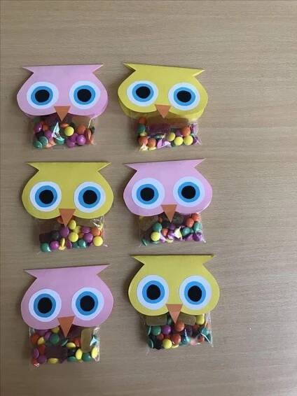 four owls made out of candy on top of a table