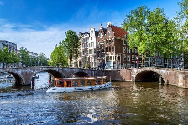 A canal boat in Amsterdam, one of the best city breaks for solo travellers
