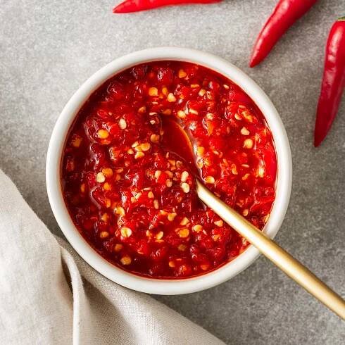 The best sambal oelek substitute (homemade sambal oelek) in a white bowl viewed from above.