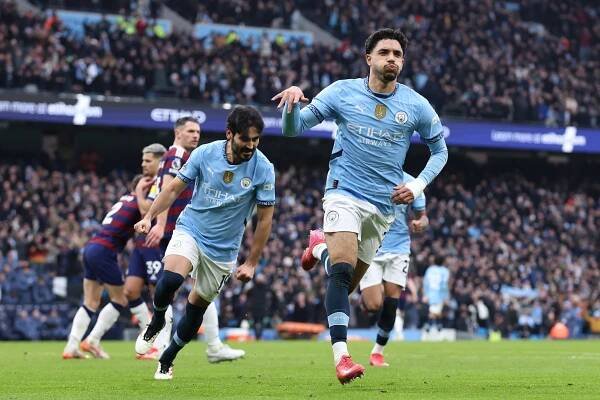 Omar Marmoush of Manchester City celebrating a goal.