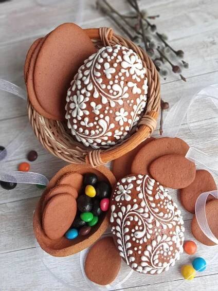 two baskets filled with cookies and candies on top of a table