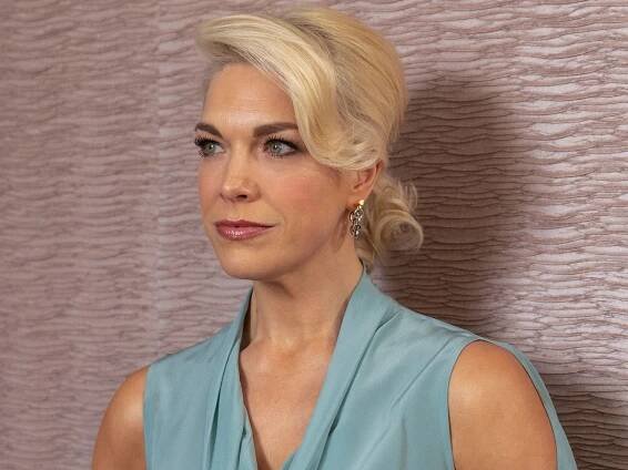 Hannah Waddingham wearing a blue dress