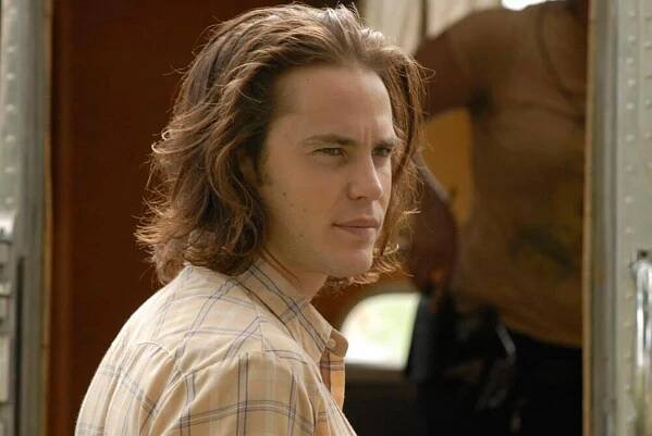 Taylor Kitsch as Tim Riggins.