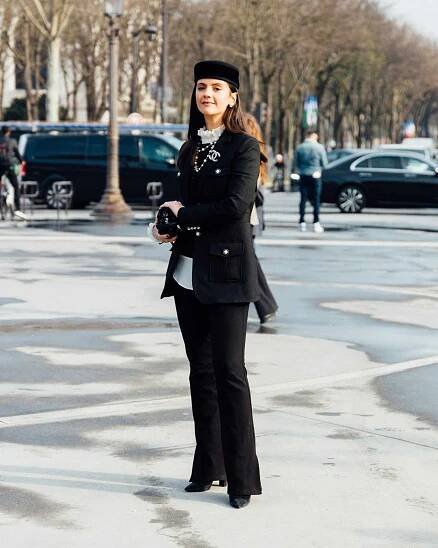 Chanel Street Style An attendee wears a pill hat
