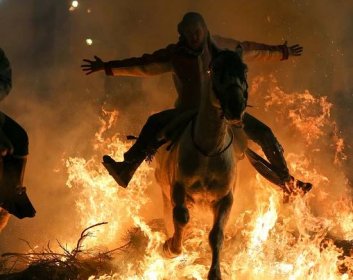 Celebrating the patron saint of animals by riding horses through flames