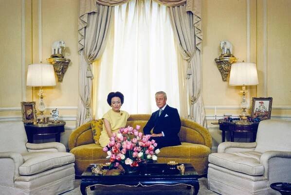 The Duke and Duchess of Windsor seated on a sofa in their New York City hotel room.
