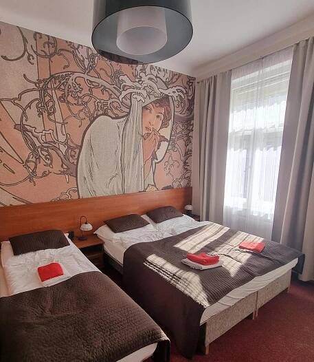 Postel nebo postele na pokoji v ubytování Hotel Klara