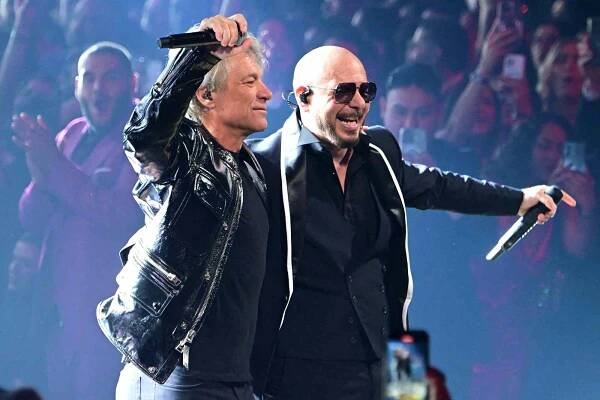 Jon Bon Jovi (L) and US rapper and singer Pitbull perform on stage during the 25th Annual Latin Grammy Awards at the Kaseya Center in Miami, Florida, on November 14, 2024.