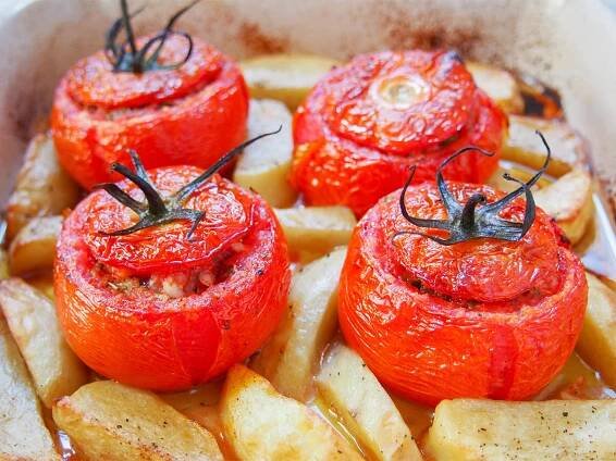 tomatoes stuffed with rice in dish