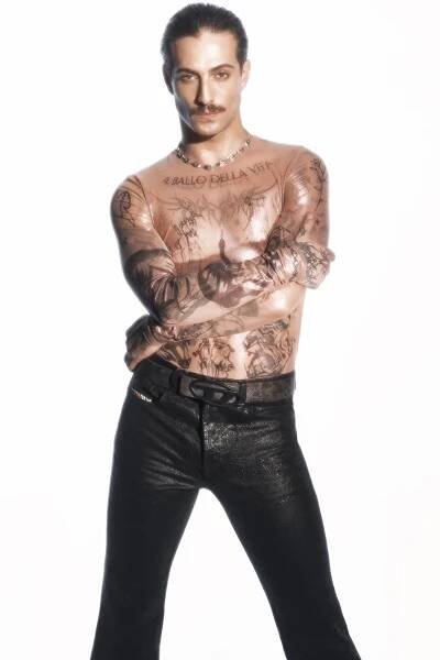 Image may contain Tony Reali Clothing Long Sleeve Sleeve Person Skin Tattoo Pants Adult Accessories and Jewelry