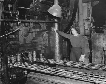 During World War II, US Steel played a critical role in the Allied forces&apos; war efforts. Here, Irma Engstom operates a punch machine in Gary, Indiana, that cut steel discs for 75mm shell cases.