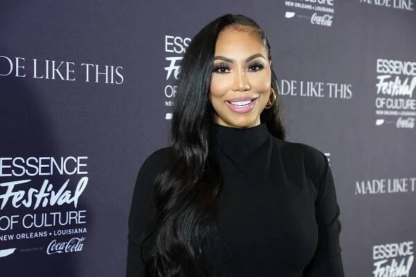 Tamar Braxton wearing a black turtleneck