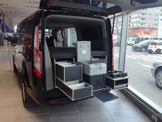 the back end of a van filled with boxes