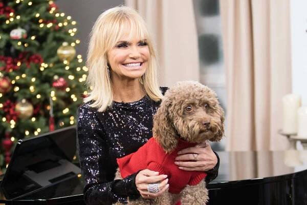 Kristen Chenoweth poses with her dog Thunder on the set of Hallmark Channel's 