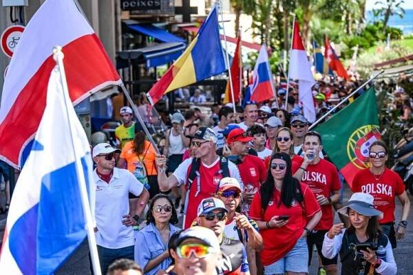 People at the Parade of Flags at the 2025 IRONMAN World Championship Nice