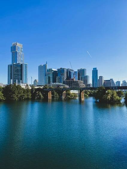 city skyline under blue sky during daytime