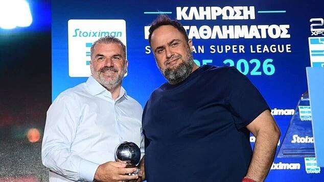 In July Marinakis handed Postecoglou an award for being the first Greek-born coach to win a major European competition