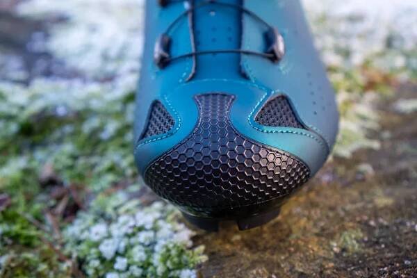 Sidi Dust MTB shoes on a wooden stump