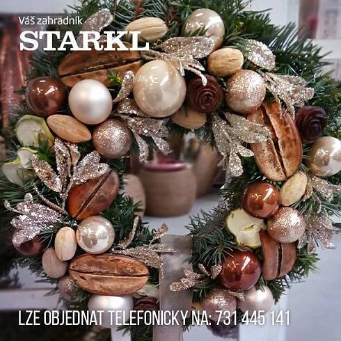 a christmas wreath with ornaments hanging from it's sides and the words starkl
