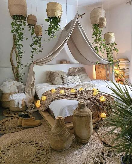 a bed with some plants and lights on it