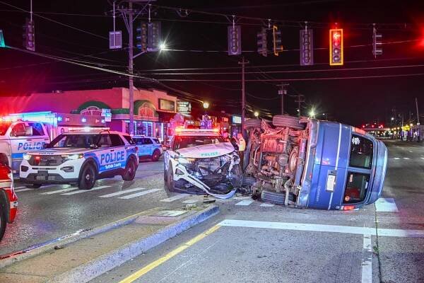 A man was killed and three people, including a police officer, were injured in two crashes minutes apart Monday morning.