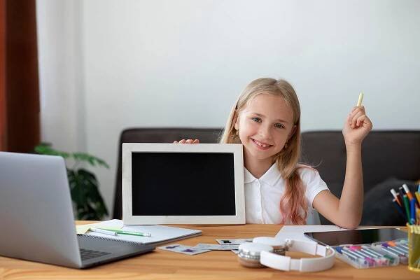 little-girl-participating-online-classes-home