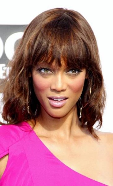 Short Hairstyles for Black Female: Tyra Banks' Light Choppy Fringe