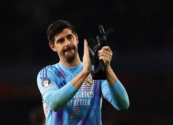 Real Madrid's Thibaut Courtois applauding after a match.